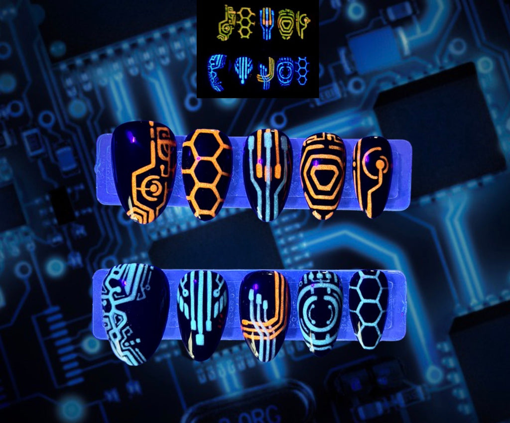The Grid glow-in-the-dark futuristic circuit press-on nails in orange and cyan by Musessence