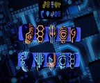 The Grid glow-in-the-dark futuristic circuit press-on nails in orange and cyan by Musessence