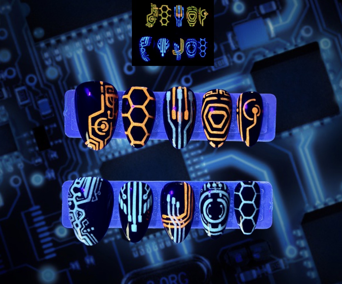 The Grid glow-in-the-dark futuristic circuit press-on nails in orange and cyan by Musessence