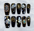 Luxury press-on nails featuring Oriental shell inlay and gold accents 