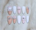 Luxury press-on nails featuring fur and matte texture design with crystal and pearl embellishments