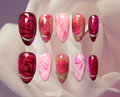 Luxury press-on nails of hyperrealistic crystal design featuring rose quartz, rhodolite, pink chalcedony 