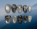 Luxury press-on nails featuring black lace and sparkling silver cateye and embellishments