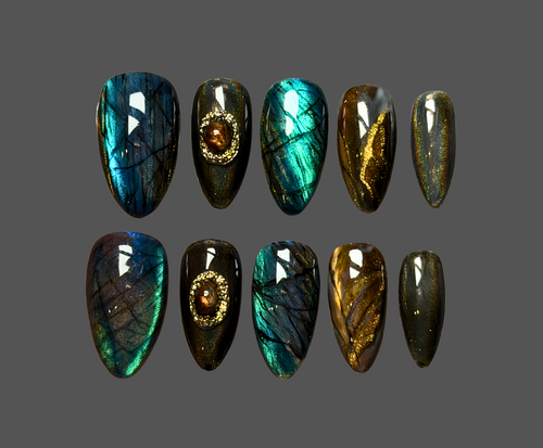 Luxury press-on nails with hyperrealistic crystal design including labradorite, smokey quartz, obsidian